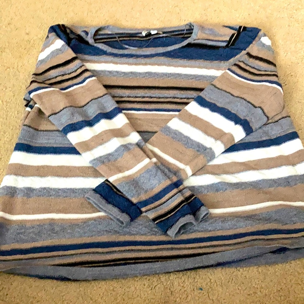 Neutral colored sweater.